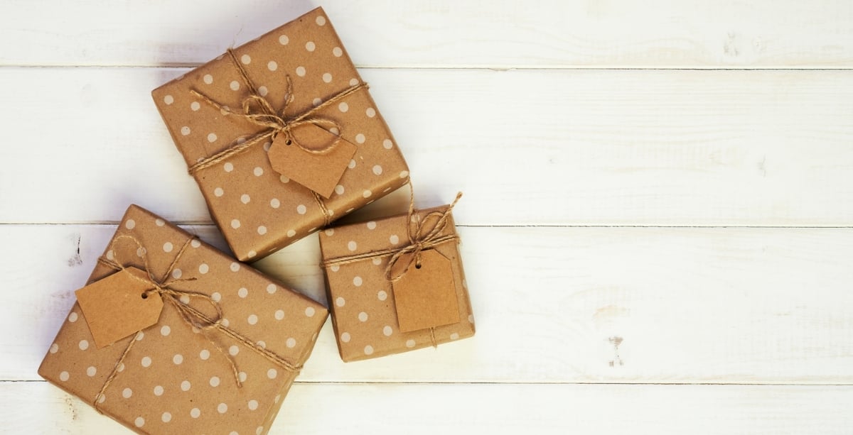 Brown paper wrapped presents with bows and tags