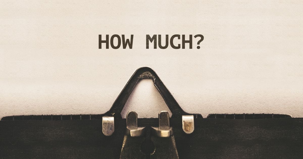 typewriter showing the words 'how much'