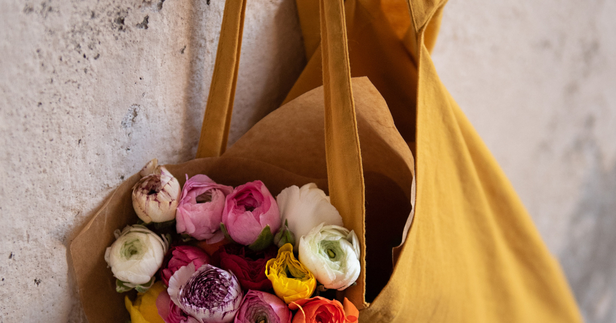 Feel Good Home Pic - Yellow tote bag filled with flowers hanging up
