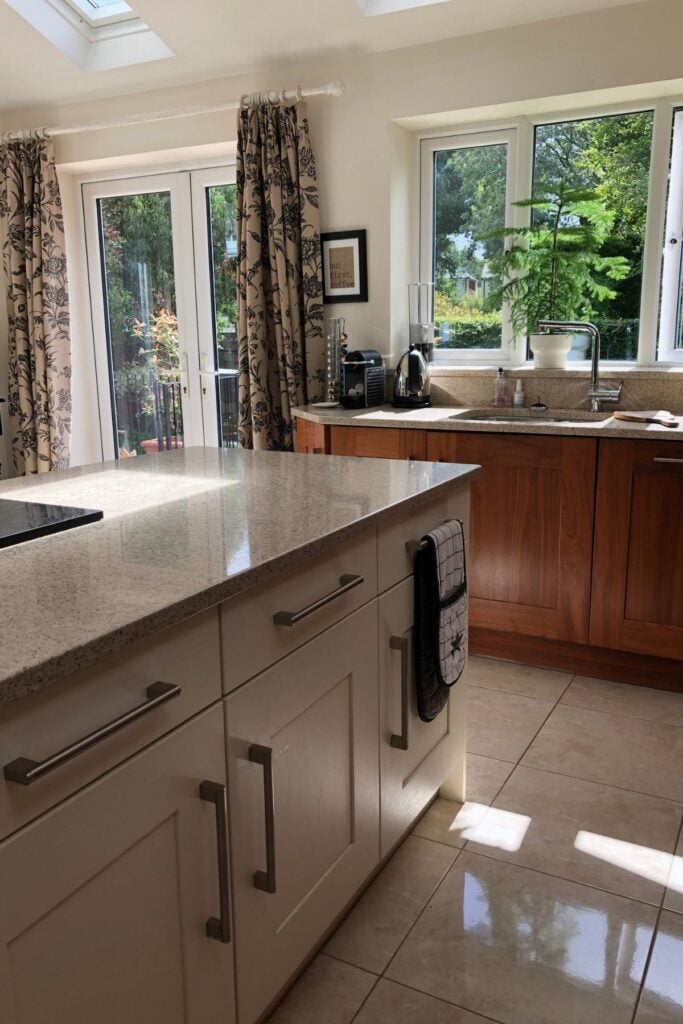 Walnut wood kitchen with ivory unit island