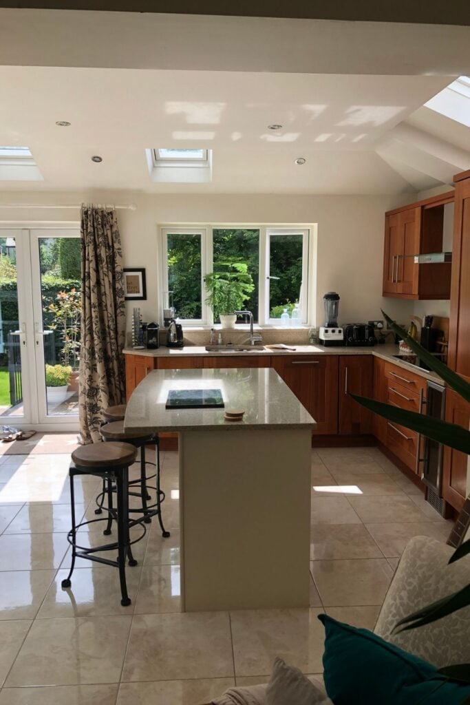 Walnut wood kitchen with ivory unit island