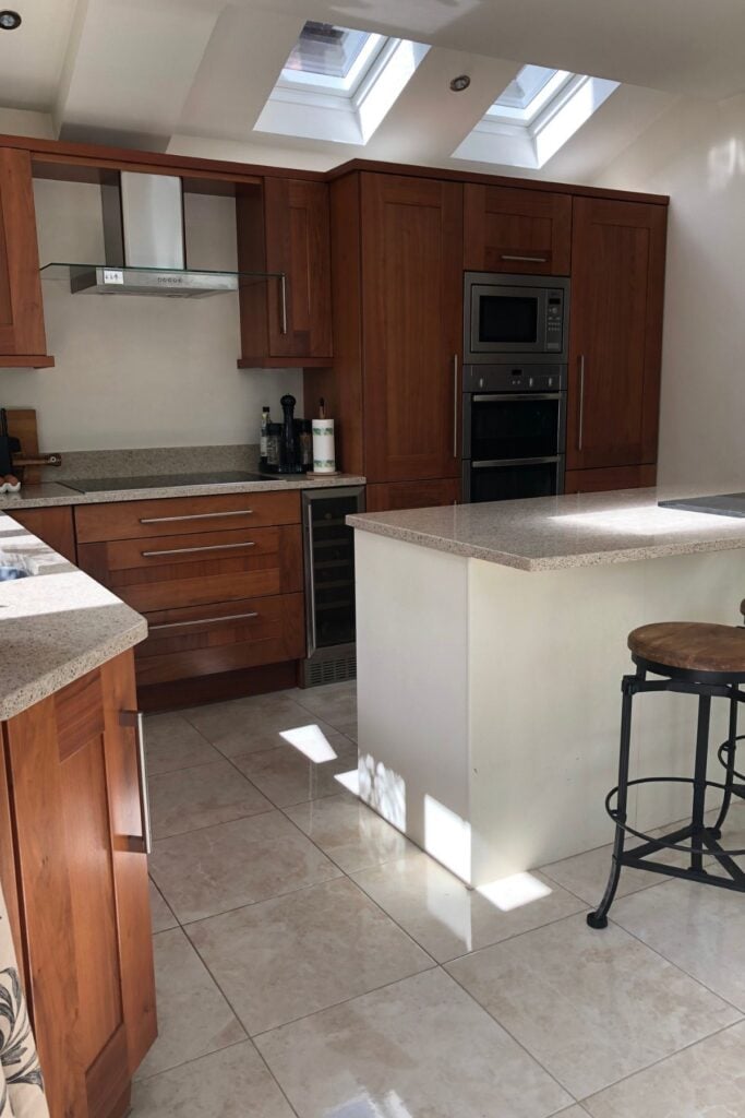 Walnut wood kitchen with ivory unit island