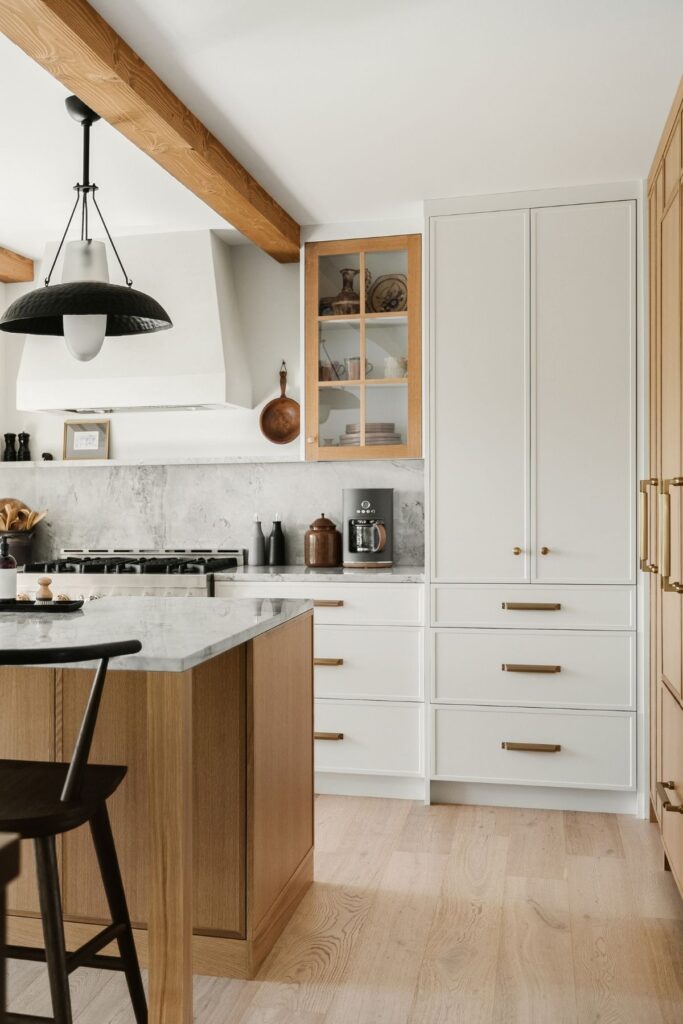 Kitchen with a pantry fitted unit in