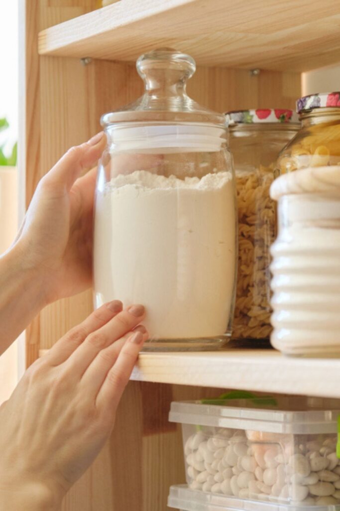 Putting jars of food onto a shelf