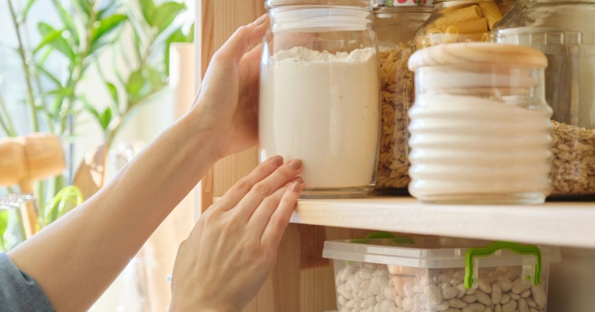 Putting jars of food onto a shelf