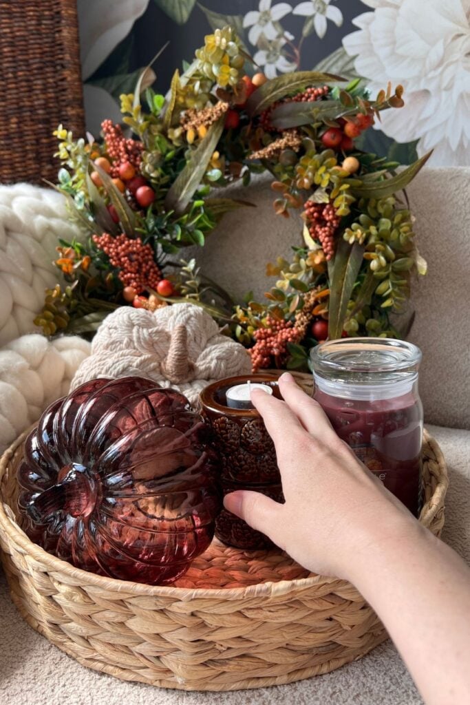 Boo basket tray with pumpkins, a set of tea light holders, and a jar candle in