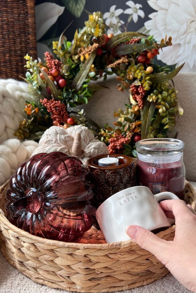 Boo basket tray with pumpkins, a set of tea light holders, a mug, and a jar candle in