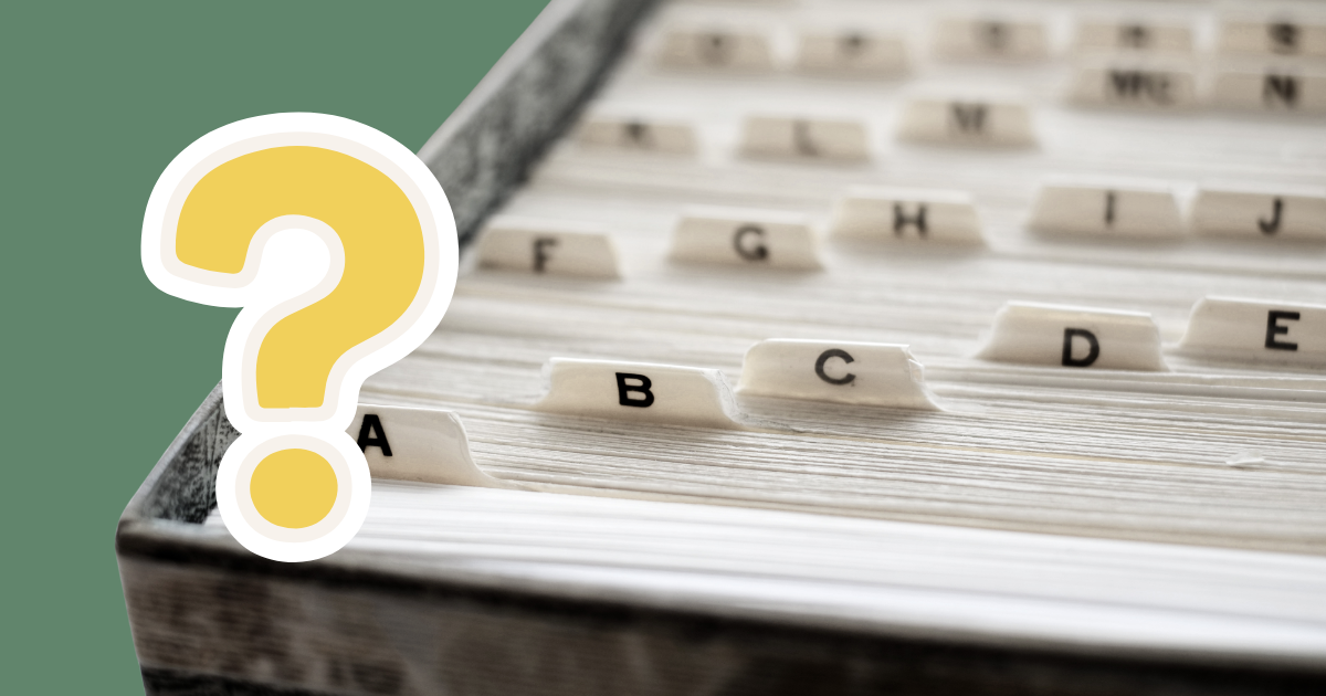Filed paperwork with A to Z tabs, along with a question mark over the top.