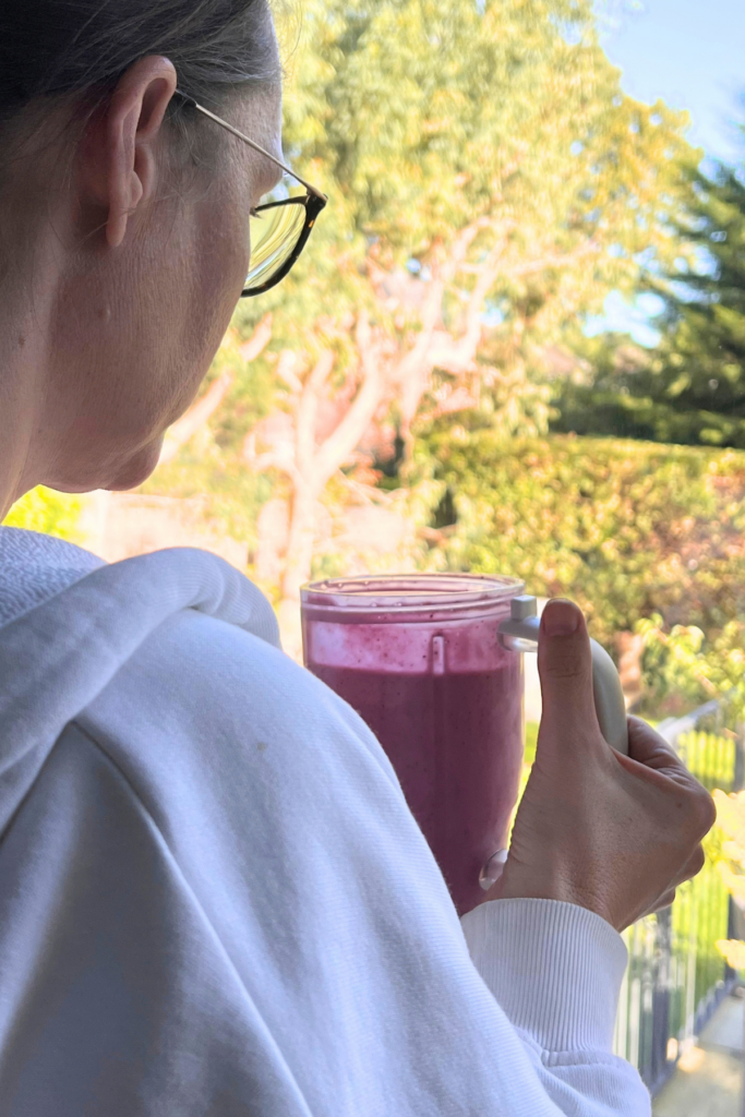 3 Simple Habits To Make Mornings Easier Every Day 9 Drinking my morning smoothie looking out of the window