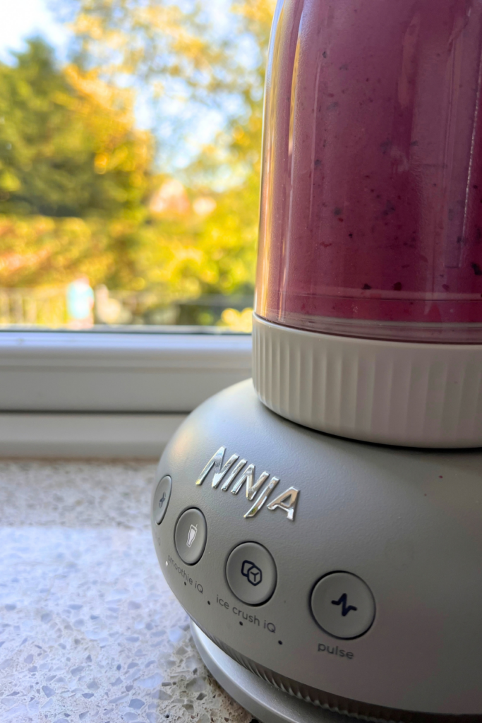 3 Simple Habits To Make Mornings Easier Every Day 7 Ninja smoothie maker on window sill mixing a berry smoothie