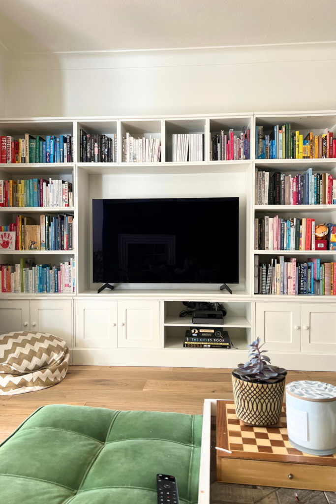 5 Ways To Sort Your Books Out (& Which Is Your Best Choice) 3 colour coded bookcase