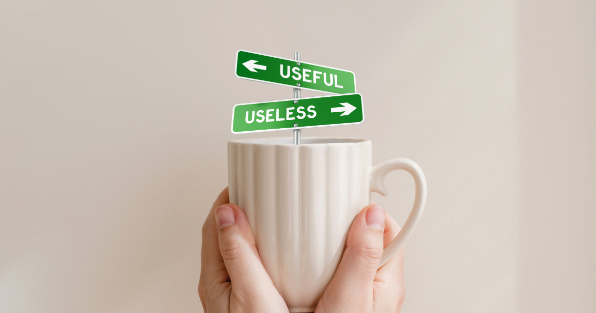 Hands holding a mug with 2 arrows coming out pointing to useless and useful